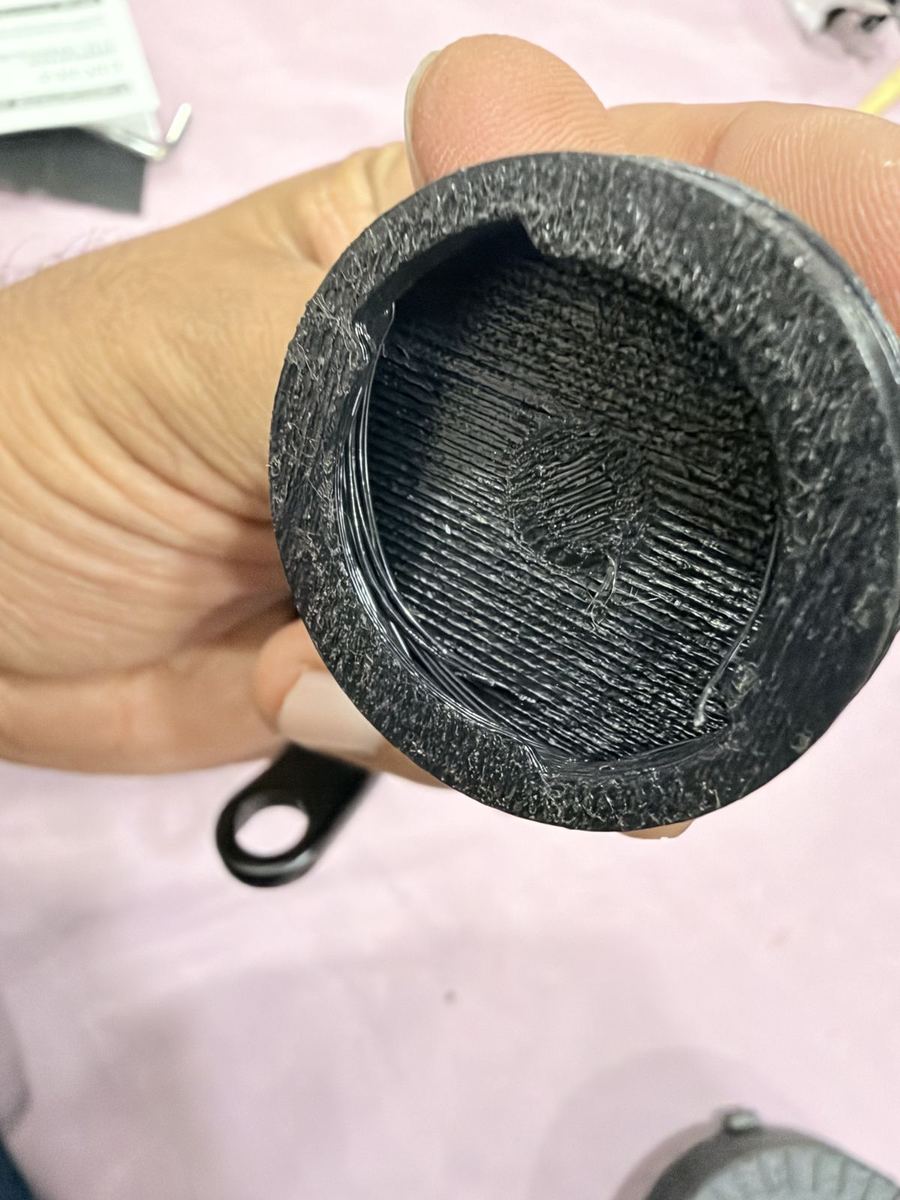 Inside of a failed 3D print with rough, stringy layers